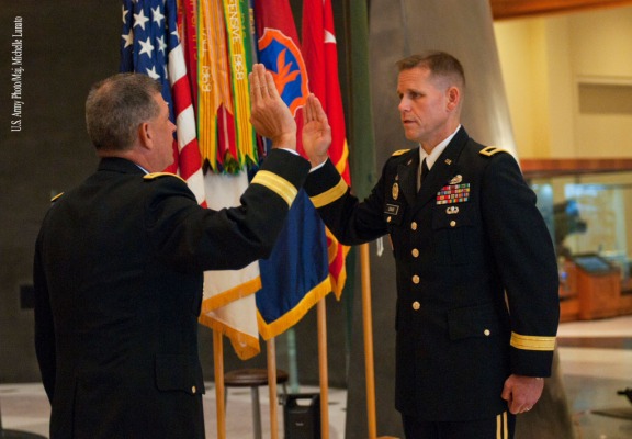 Maj. Gen. Mark T. McQueen, commander of the 108th Training Command (Initial Entry Training), administers the Oath of Office to Brig. Gen. Miles Davis during a promotion ceremony on September 11th at the National Infantry Museum at Fort Benning. Shortly after the promotion ceremony, Brig. Gen. Davis assumed command of the 98th Training Division (IET) on the parade field of the museum.